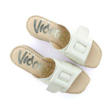 Load image into Gallery viewer, Pair of white leather sandals with beige soles on a white background