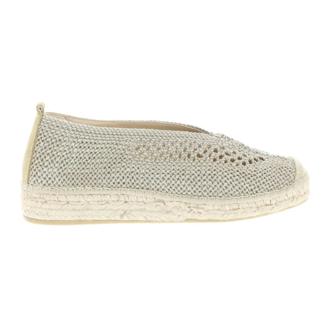 Textured espadrille shoe on a white background